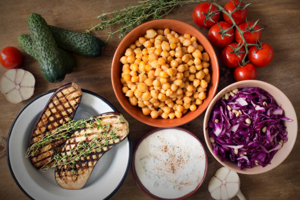 istock Fresh organic vegetables on wooden rustic background top view. 817281646