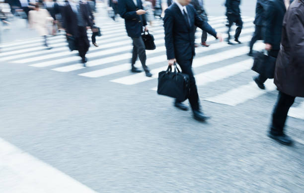 istock Busy City Commuters at Crosswalk in Tokyo 817285516
