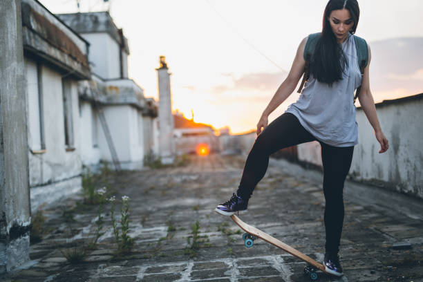 istock Young woman on skateboard 817290066