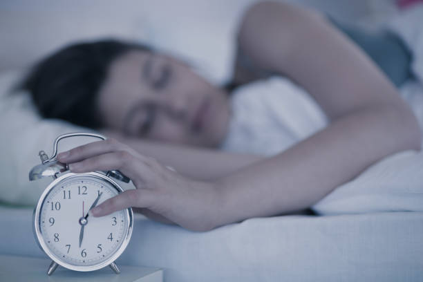 istock Beautiful brunette sleeping in her bed 817290902