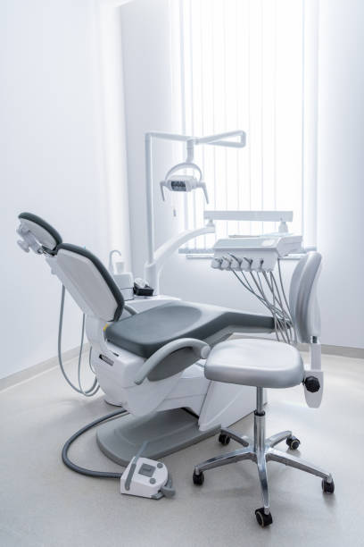 istock empty dentist office with chair and various dental equipment 817293286