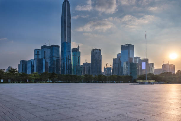 istock empty brick platform with Shanghai skyline in background at sunrise/sunset 817298520