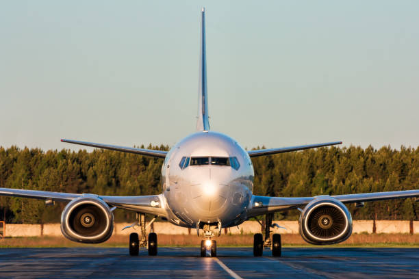 istock Front view taxiing airplane with one engine running 817301306