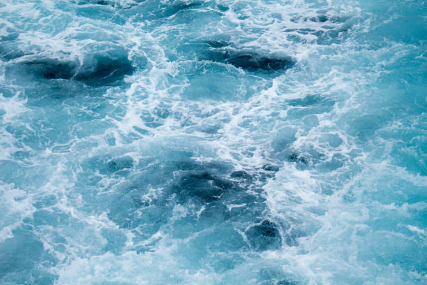 istock Abstract water background. Cruise ship tail in the blue sea. 817306720