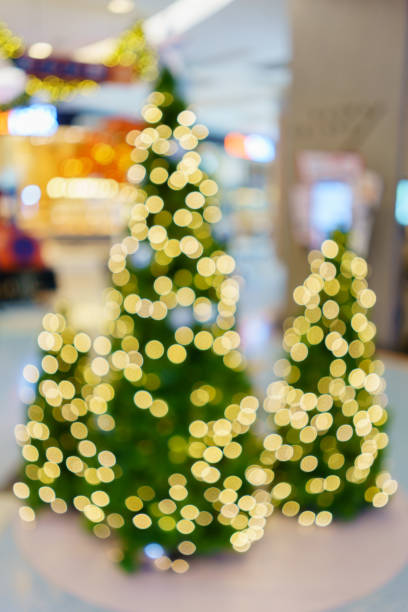 istock Blurry traditionally decorated Artificial Christmas trees and bokeh 817310144