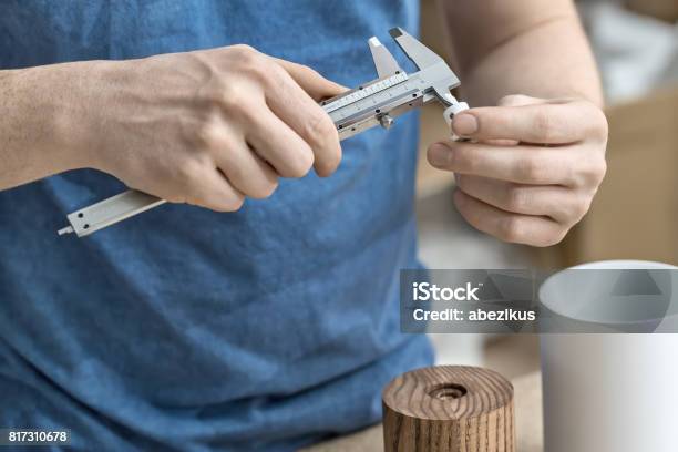 Worker Using Calipers Man Using Caliper In Workshop Stock Photo - Download Image Now ...