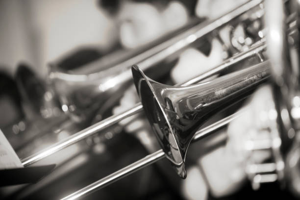 istock Close-up view of musicians playing trombone. 817313342