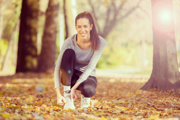 istock Young woman exercise in the park 817314068