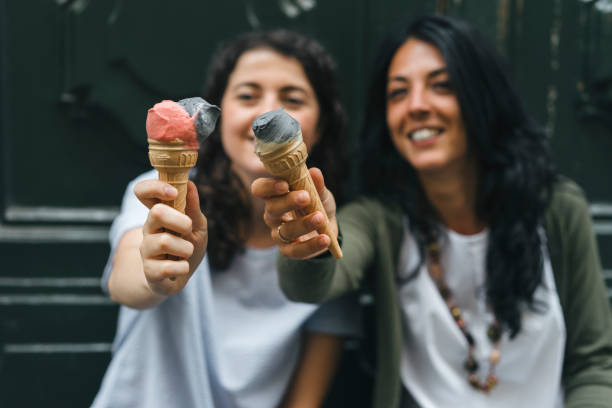 istock Two friends eating ice-cream together 817316602