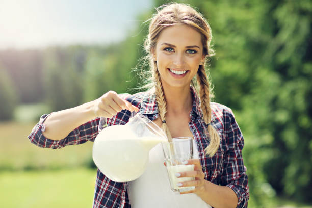 istock Young woman with fresh organic milk 817318746