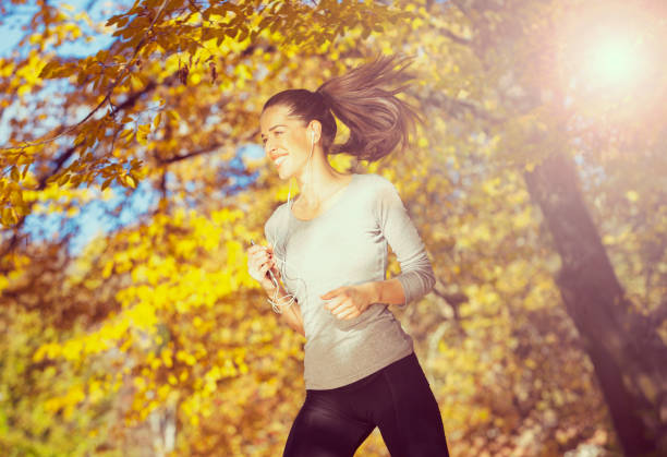 istock Young woman exercise in the park 817318892