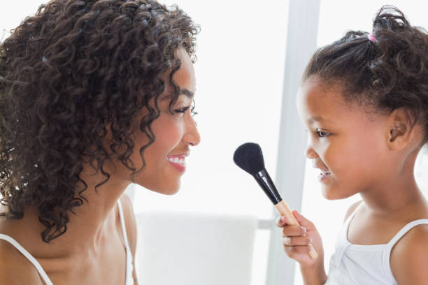 istock Pretty mother teaching her daughter about makeup 817319228