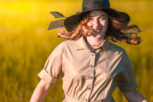 istock Happy Redhead Woman On Golden Field 817328480