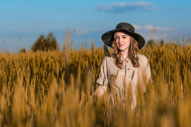 istock Young Woman At Wheat Field 817328484