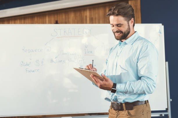 istock Jolly youthful bearded guy training at work in office 817338526