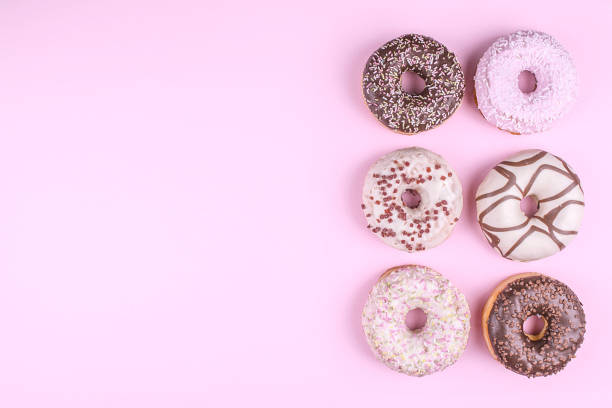 istock Colorful donuts on pink background. 817339358