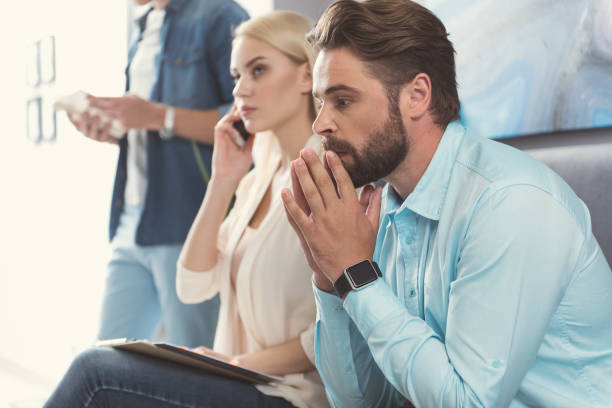 istock Pensive youthful guy waiting for employment interview in office 817339452