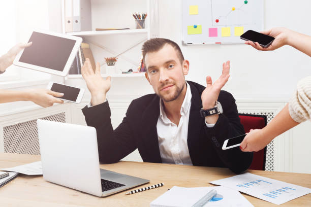 istock Young stressed overworked businessman in modern office 817348476