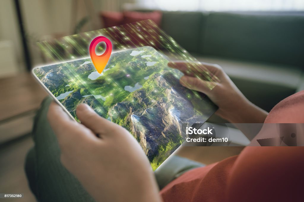 Augmented reality on a tablet Augmented reality on a tablet. 3D map element designed by photographer. Travel Stock Photo