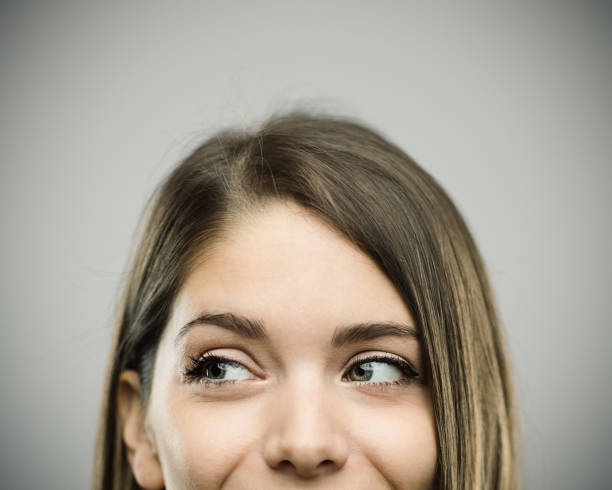 istock Real happy young woman studio portrait looking away 817354902