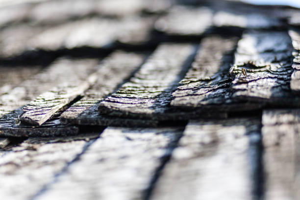 Metal roofing tiles against clear blue sky. Abstract architecture background