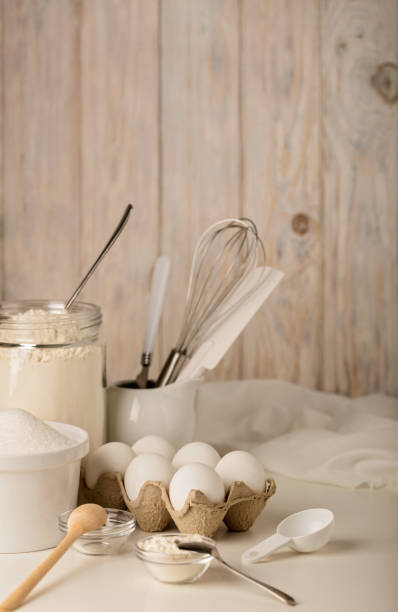 istock Kitchen utensils and tools for homemade baking on a light wooden background. 817360558