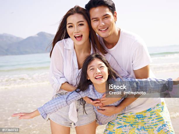 Asian Family Having Fun On Beach Stock Photo - Download Image Now - Family, Asian and Indian Ethnicities, Asia