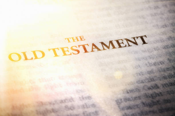 Brightly lit page of the Old Testament of The Bible stock photo