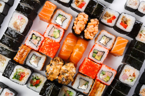 istock Set of sushi, maki and rolls isolated on white background 817377980