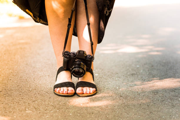 Close-Up Of Young Woman Holding Camera