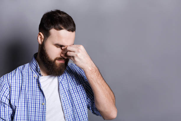 istock Depressed bearded man with closed eyes 817389048