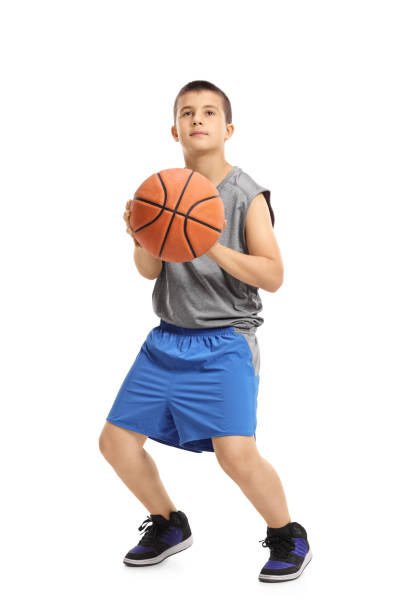 Boy about to throw a basketball