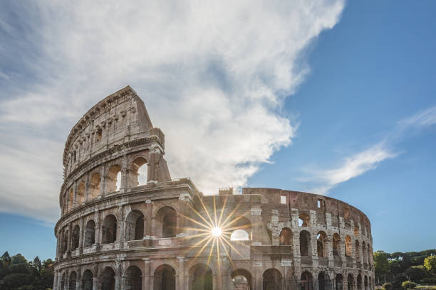 View of Colosseum in Rome and Morning Sun, Italy, Europe. stock photo