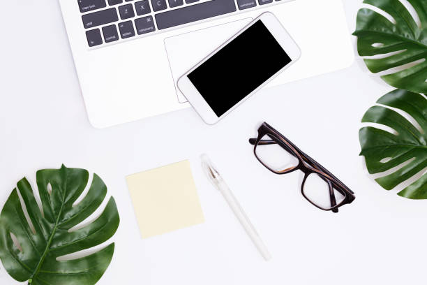 istock White office desk table with a lot of things on it. Top view with copy space. 817401088