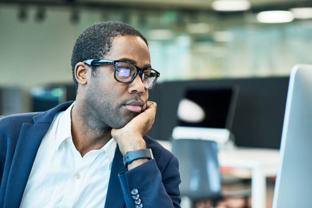 istock Tired African Businessman Working with  Computer in Office 817401192