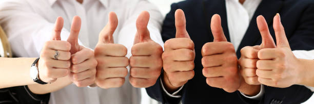 istock Group of people show OK or confirm with thumb up 817402176