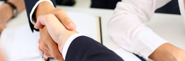 istock Man in suit shake hand as hello in office 817402210