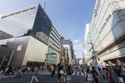 Tokyo, Japan - August 11, 2016 : Pedestrians walk past Ginza in downtown Tokyo. Ginza shopping district, the most expensive real estate price in Japan.