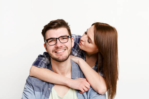 istock Happy casual couple posing to camera, isolated 817405150