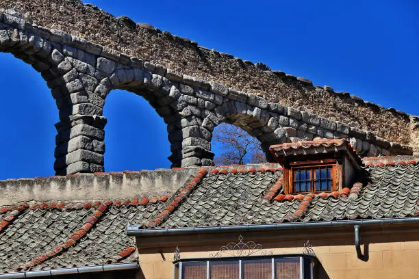 Photo of The Roman Aqueduct of Segovia (The Aqueduct Bridge), one of the best-preserved elevated Roman Aqueducts and the foremost symbol of Segovia as the city's coat of arms, located in Plaza del Azoguejo, Segovia, Spain