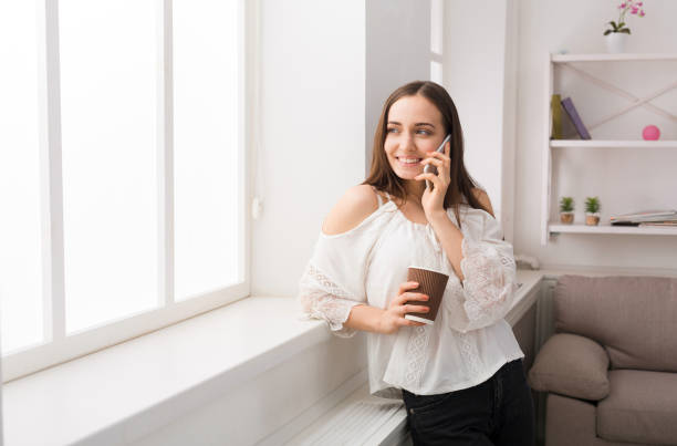 istock Happy woman talking on mobile phone 817419220