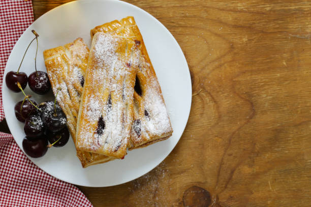 istock Strudel from puff pastry with cherry filling 817425766