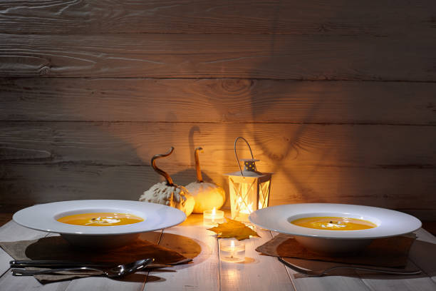 Romantic halloween dinner with pumpkin soup