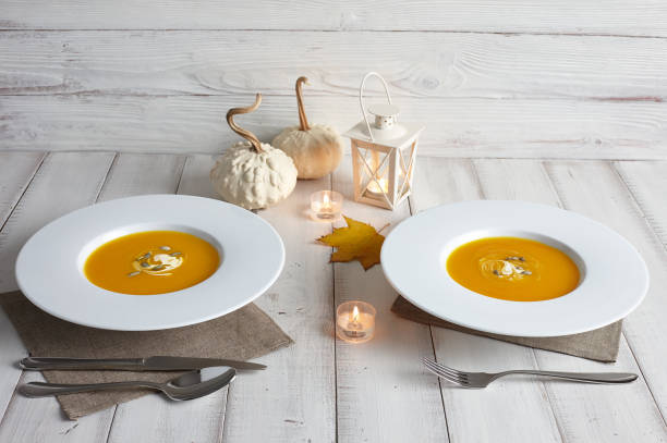 istock Romantic halloween dinner with pumpkin soup 817431238