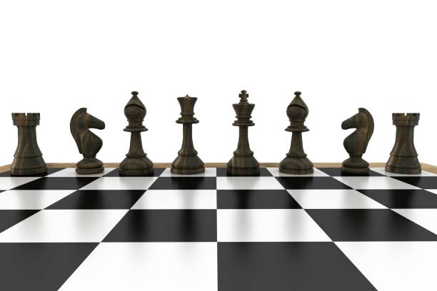 istock Black chess pieces in a row 817431594