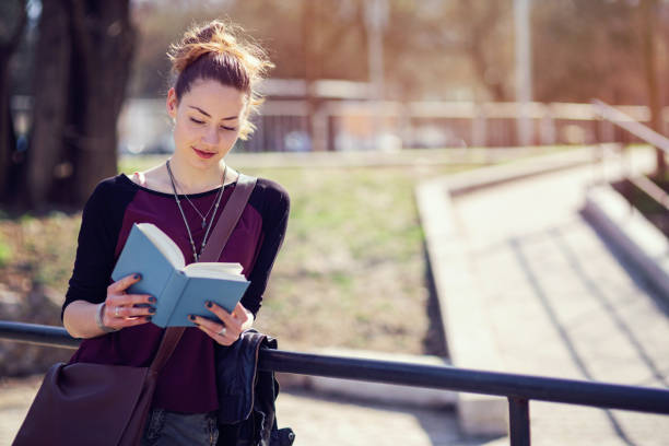 istock Woman spending her spare time reading a book 817432078