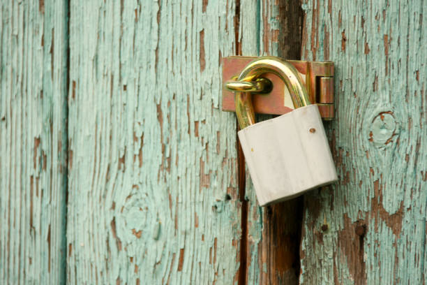 istock New lock on the old door 817436874