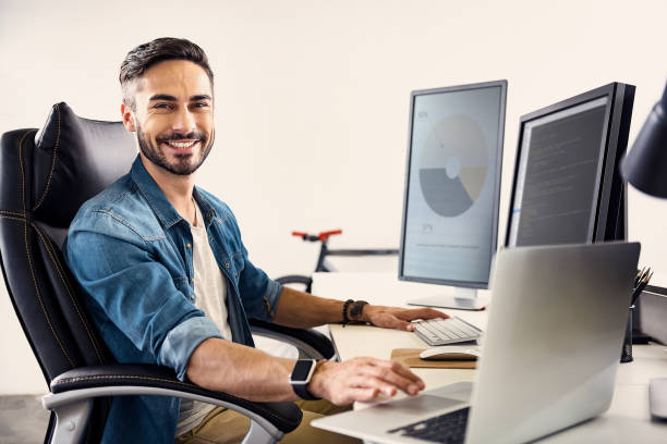 istock Happy male having job on notebook computer 817439956