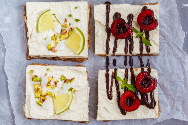 istock Raw pistachio, coconut, lime and chocolate-cherry cheesecakes 817441700
