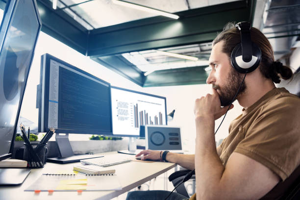 istock Serene male hearing song during work 817442704